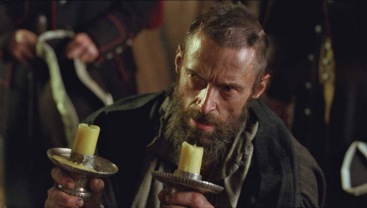 From the movie: Valjean accepts as a free gift the silver he stole from the Bishop