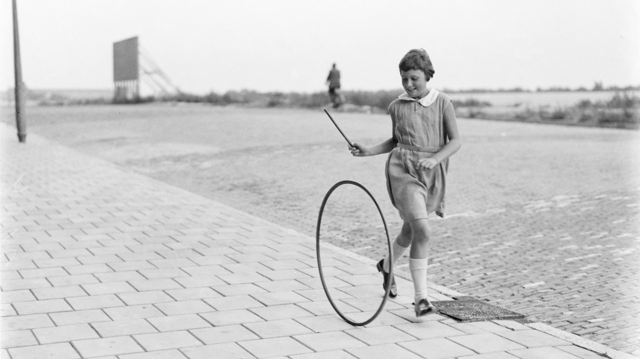 Photo: Girl rolling a hoop